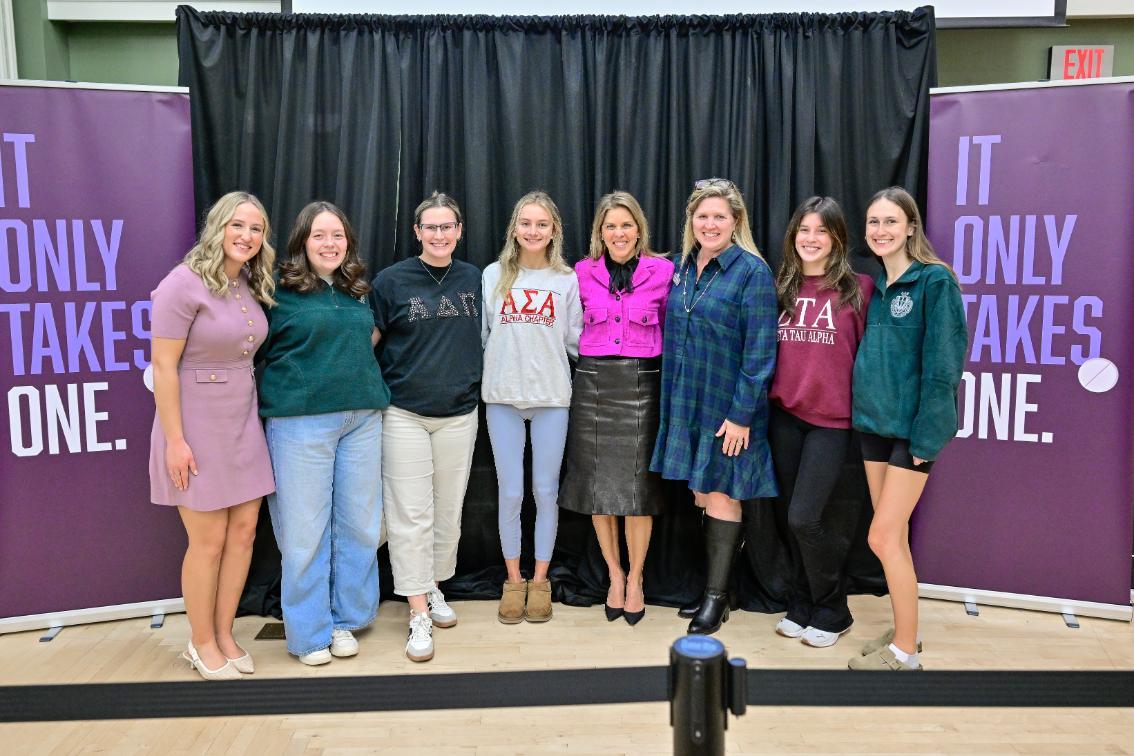Members of the College Panhellenic Council, the governing board over campus sororities, pose for a photo with Virginia's First Lady