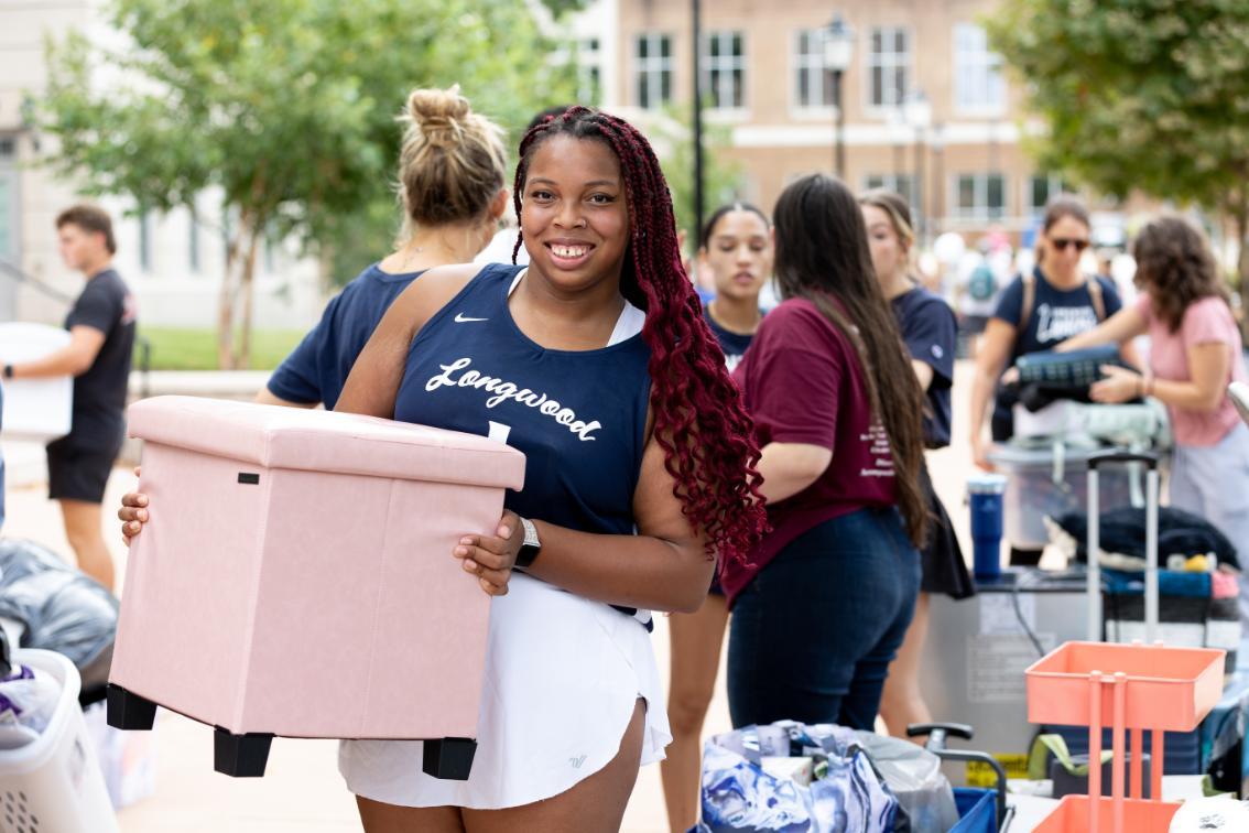 Sophomore Serenity Opie ’28 and her cheerleading teammates infused plenty of Lancer spirit into the move-in process.