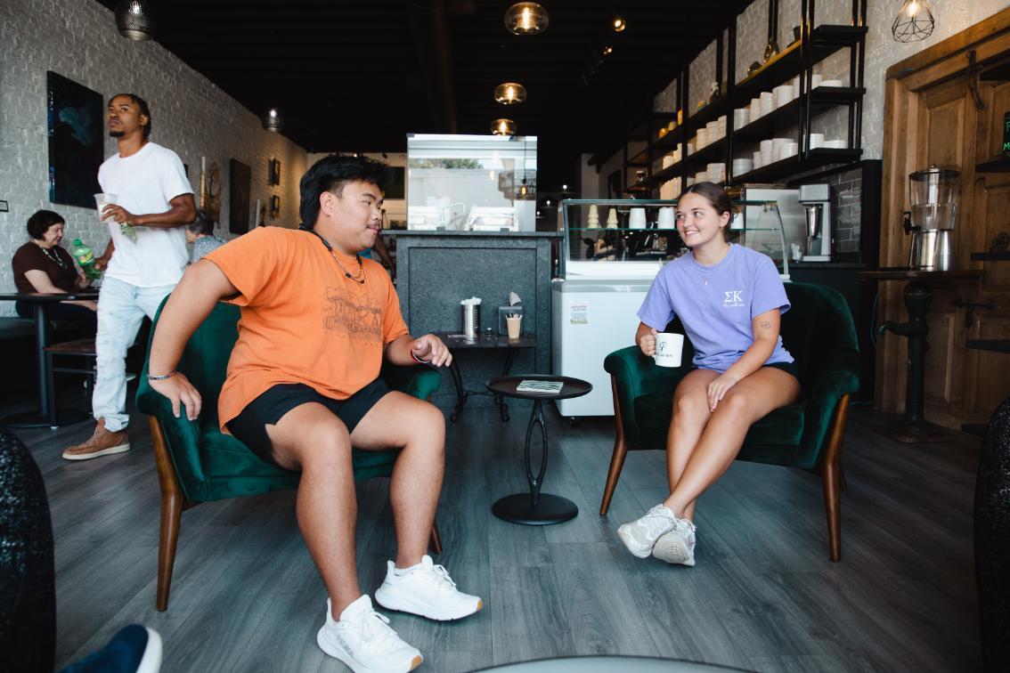 Students enjoying refreshments at Poplar Sips
