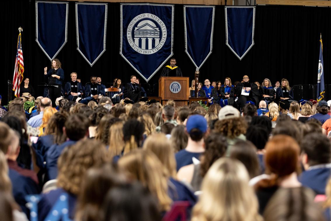 Cainan Townsend ’15, M.S. ’20 addresses the audience at Convocation 2025