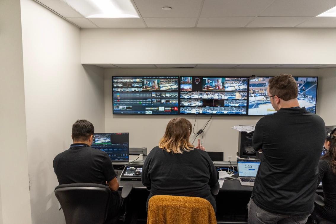 Jose Ramos Flores ’26 (left), McKayla Moxcey ’26 (middle) and Longwood director of video operations Brandon Fenters ’21 (right)