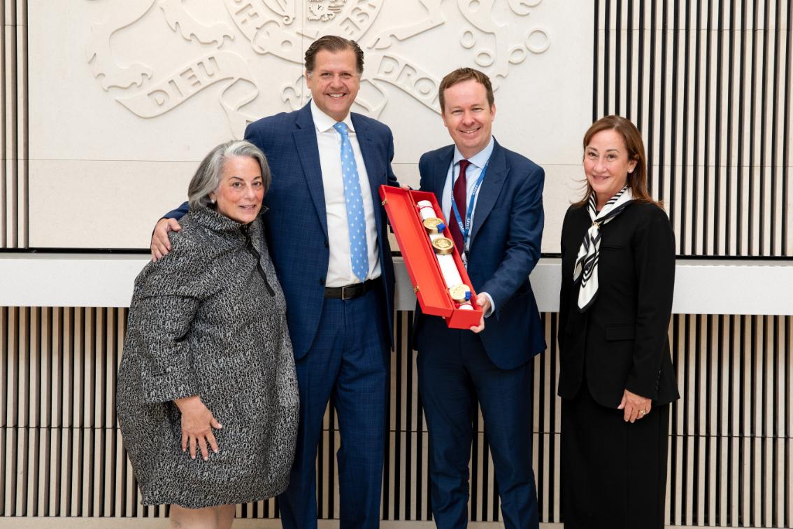 Embassy Counsellor Colin McDonald (second from right) presents Longwood’s official coat of arms and armorial bearings to former rectors of the Board of Visitors Pia Trigiani (left), Marianne Radcliff ’92 (right), and President W. Taylor Reveley IV at the British Embassy in Washington, D.C. on June 16, 2026.