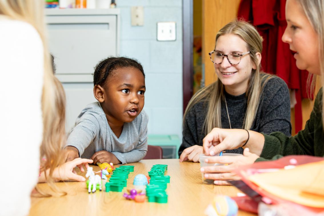 A Longwood student teacher interacts with a student at nearby Cumberland Elementary School