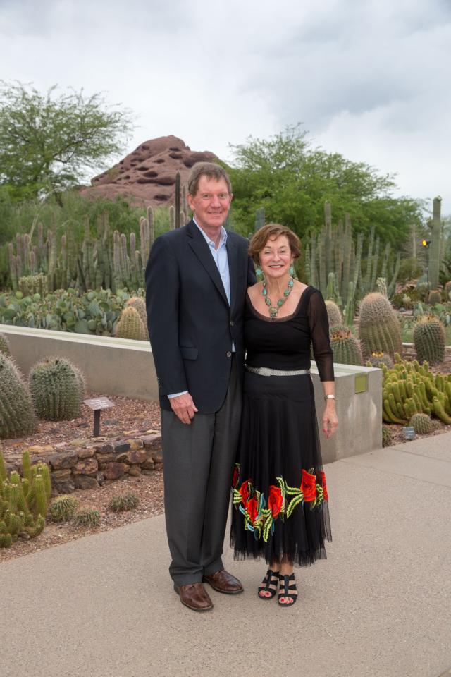Richard and Carole Dawson Kraemer '67 post together with the Arizona landscape in the background.
