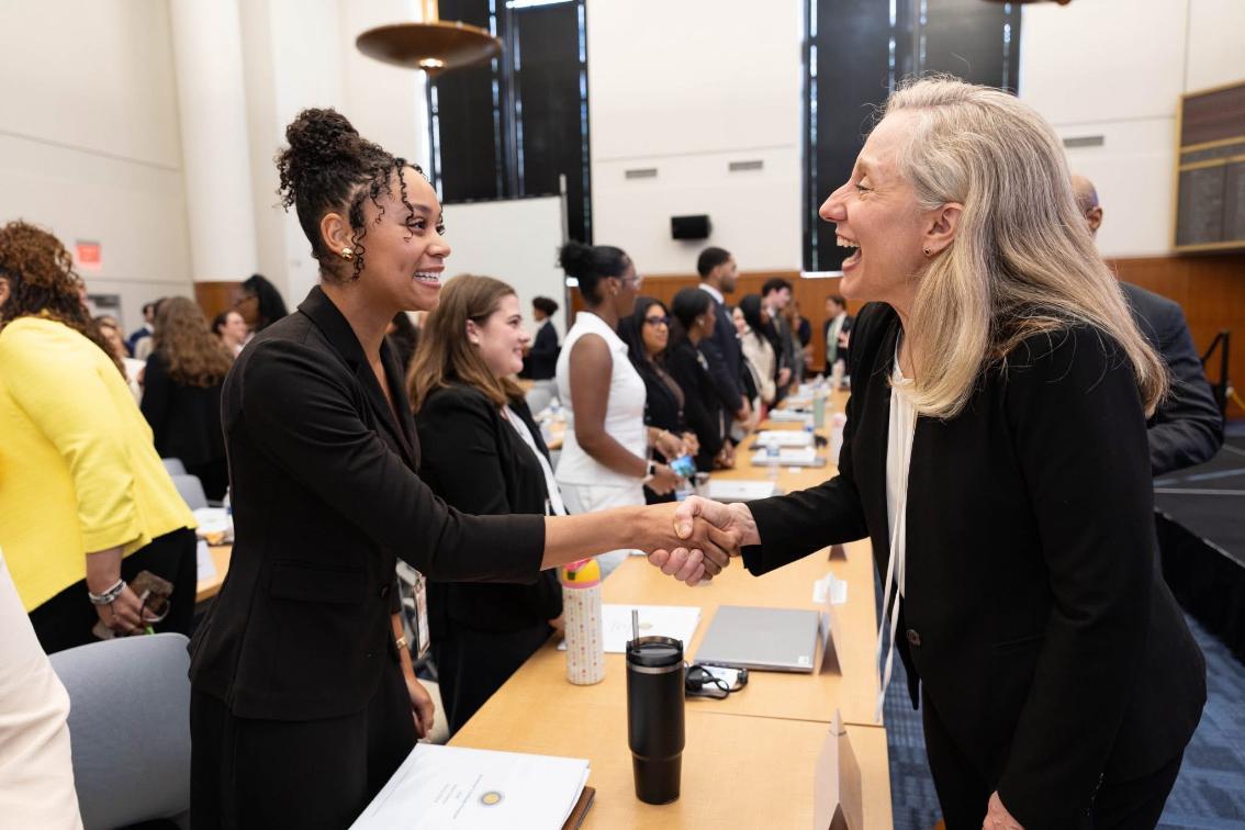 Naiya Casimiro '27 shakes hands with Governor Abigail Spanberger during Fellow Orientation (Photo credit: Office of the Governor)